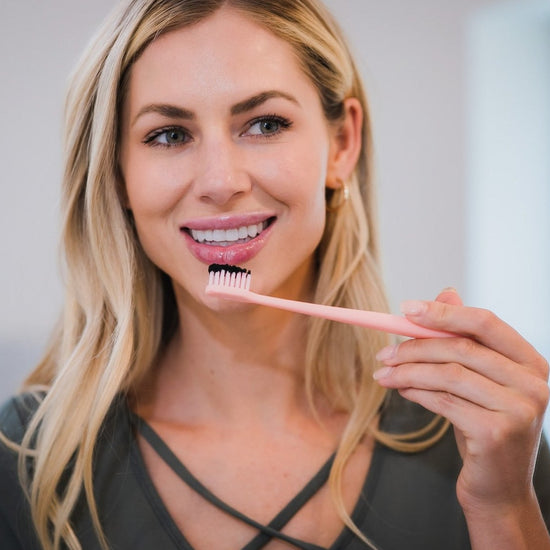 brush your teeth with activated charcoal powder